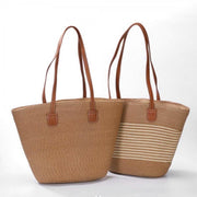 Woven straw tote bags with brown faux leather shoulder straps and structured shape