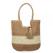 Two-tone woven straw tote bag with tassel detail and top handles in neutral shades