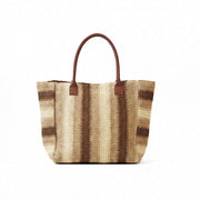 Woven straw tote bag with lattice texture and tan shoulder straps
