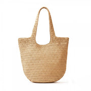 Round bottom woven straw tote bag with wide shoulder straps and natural finish