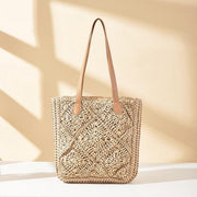 Multi-color woven straw tote bag with vertical stripe pattern and brown handles
