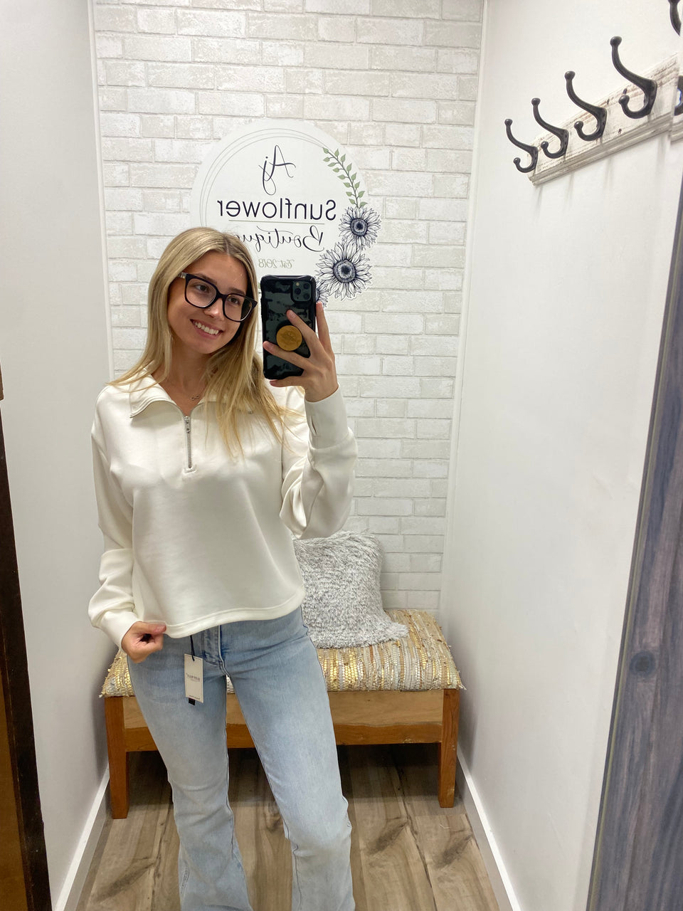 a woman taking a selfie in a bathroom