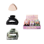 Set of makeup items including a beige compact, black hair clip, and a display box labeled 'crush'.